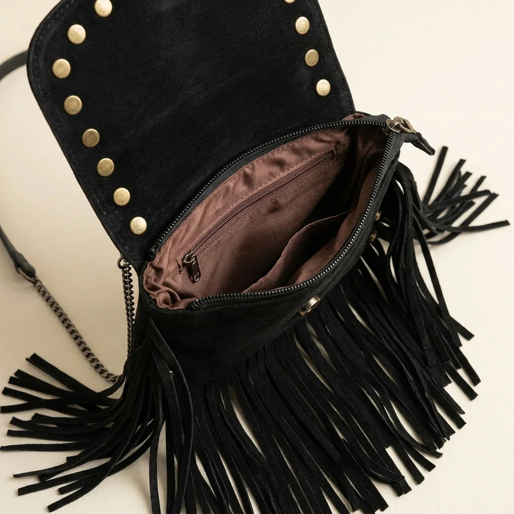 Interior lining and pockets of Black studded fringe crossbody bag