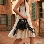 Woman wearing Black studded fringe crossbody bag with swaying fringe