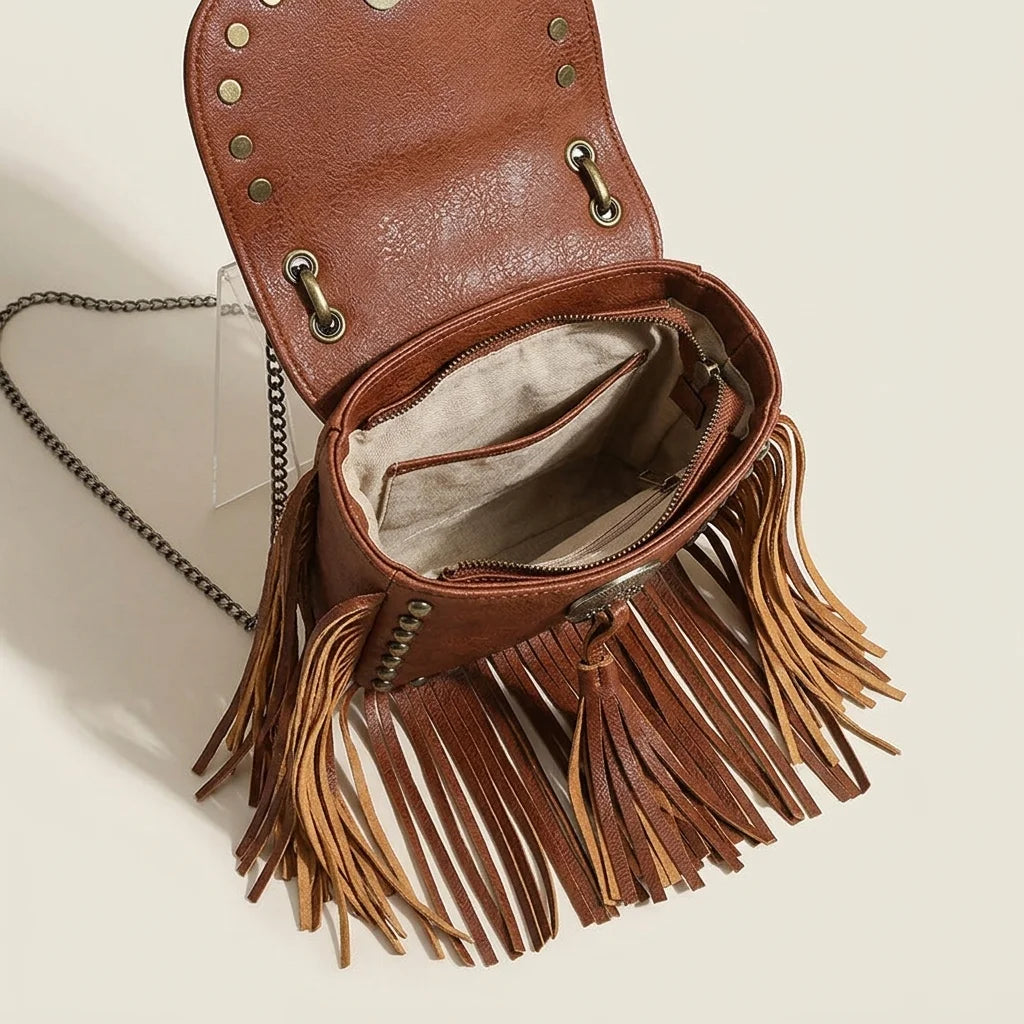 Interior lining and pockets of Brown studded fringe crossbody bag