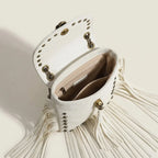 Interior lining and pockets of White studded fringe crossbody bag