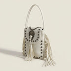 White studded fringe crossbody bag, three-quarter angle showing side depth