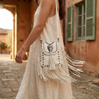 Woman wearing White studded fringe crossbody bag with swaying fringe