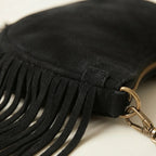 Close-up of fringe stitching and texture on Black suede fringe clutch bag