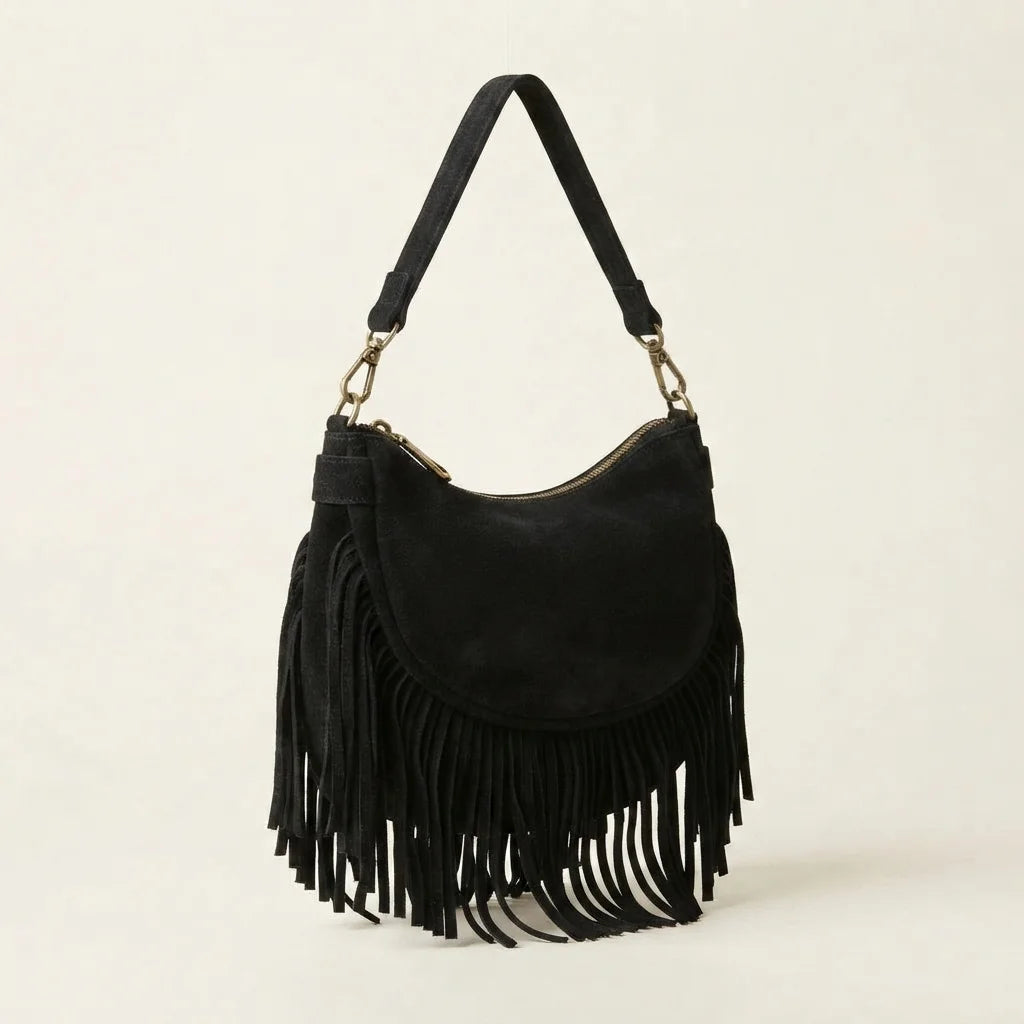 Black suede fringe clutch bag, three-quarter angle showing side depth