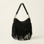Black suede fringe clutch bag, three-quarter angle showing side depth