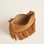 Interior lining and pockets of Camel suede fringe clutch bag