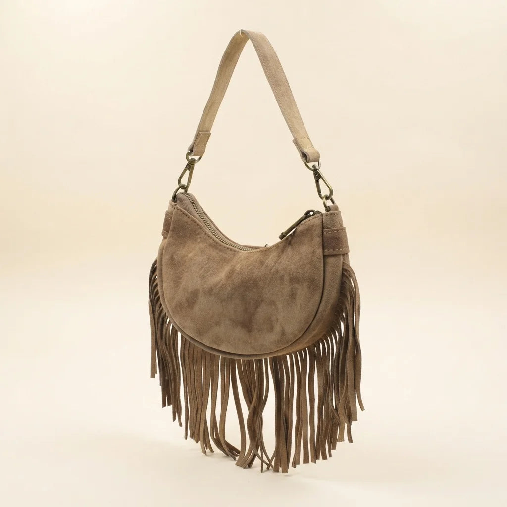 Camel suede fringe clutch bag, three-quarter angle showing side depth