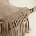 Close-up of fringe stitching and texture on Taupe suede fringe clutch bag