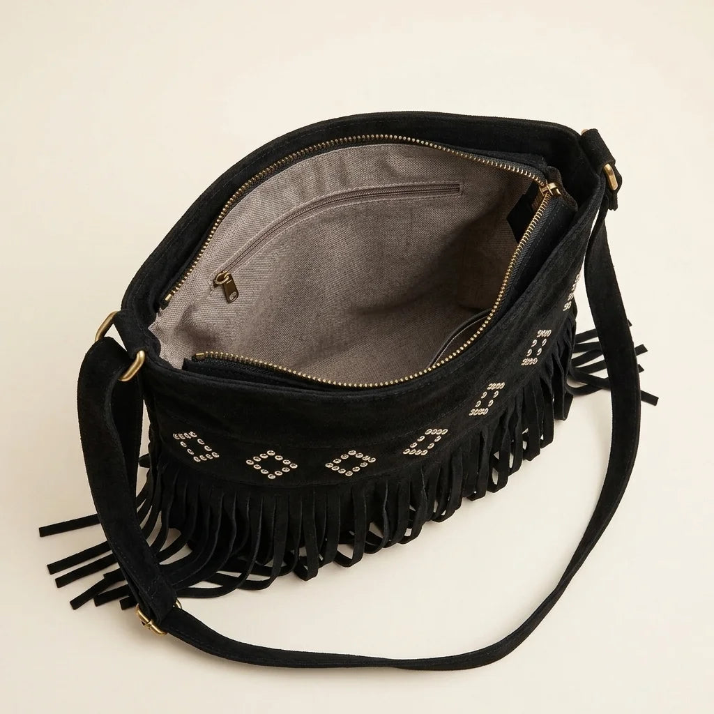Interior lining and pockets of Black suede fringe messenger bag