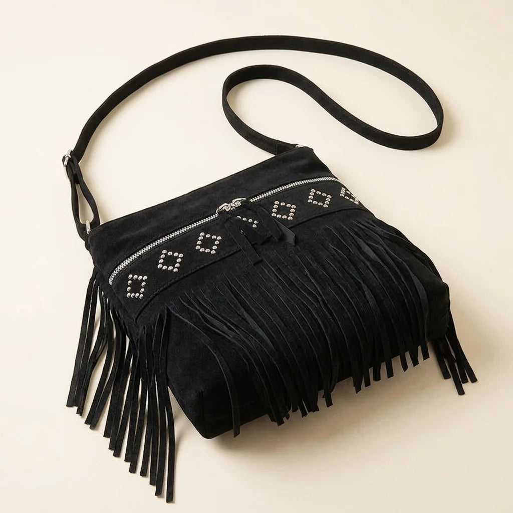 Black suede fringe messenger bag, three-quarter angle showing side depth