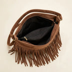 Interior lining and pockets of Brown suede fringe messenger bag
