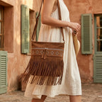 Woman wearing Brown suede fringe messenger bag with swaying fringe