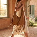 Woman wearing Brown suede leather fringe bag with swaying fringe