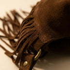 Close-up of fringe stitching and texture on Coffee suede leather fringe bag
