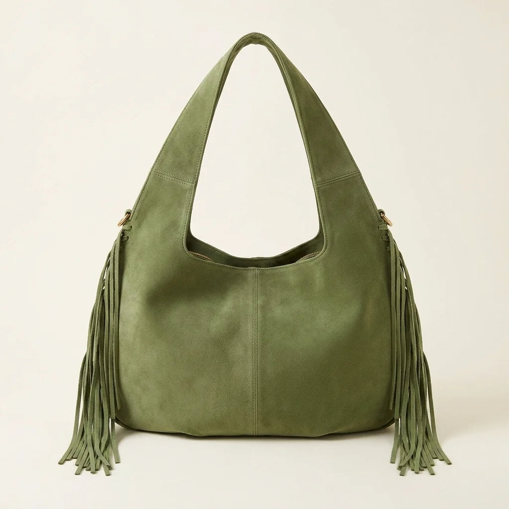 Back panel of Green suede leather fringe bag with strap attachments