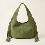 Back panel of Green suede leather fringe bag with strap attachments