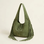 Green suede leather fringe bag, three-quarter angle showing side depth