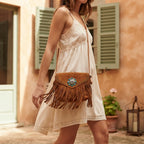 Woman wearing Brown suede leather fringe crossbody bag with swaying fringe