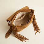 Interior lining and pockets of Khaki tan fringe bag