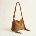 Khaki tan fringe bag, three-quarter angle showing side depth