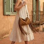 Woman wearing Khaki tan fringe bag with swaying fringe