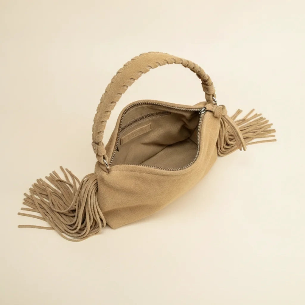 Interior lining and pockets of Tan tan fringe clutch bag