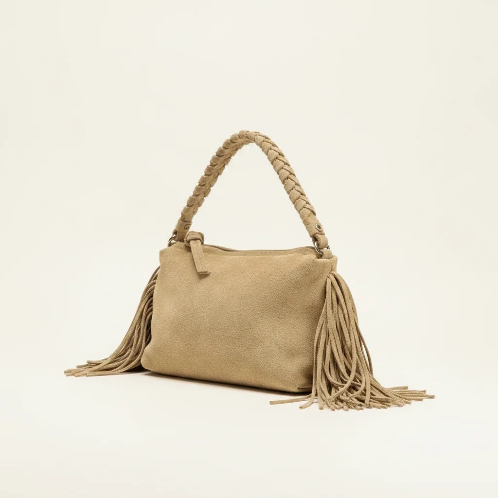 Tan tan fringe clutch bag, three-quarter angle showing side depth