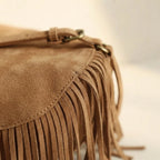 Close-up of fringe stitching and texture on Light Brown tan fringe crossbody bag