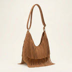 Brown tan fringe hobo bag, three-quarter angle showing side depth