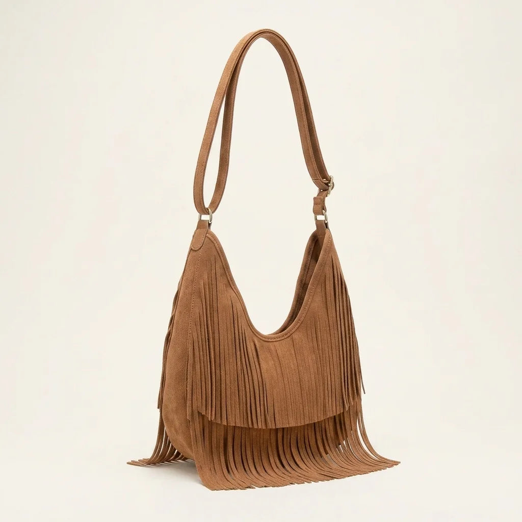 Brown tan fringe hobo bag, three-quarter angle showing side depth