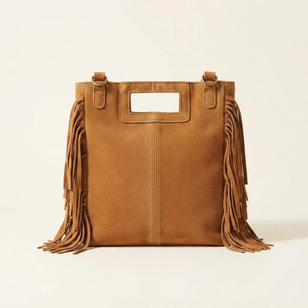 Back panel of Camel tan fringe shoulder bag with strap attachments