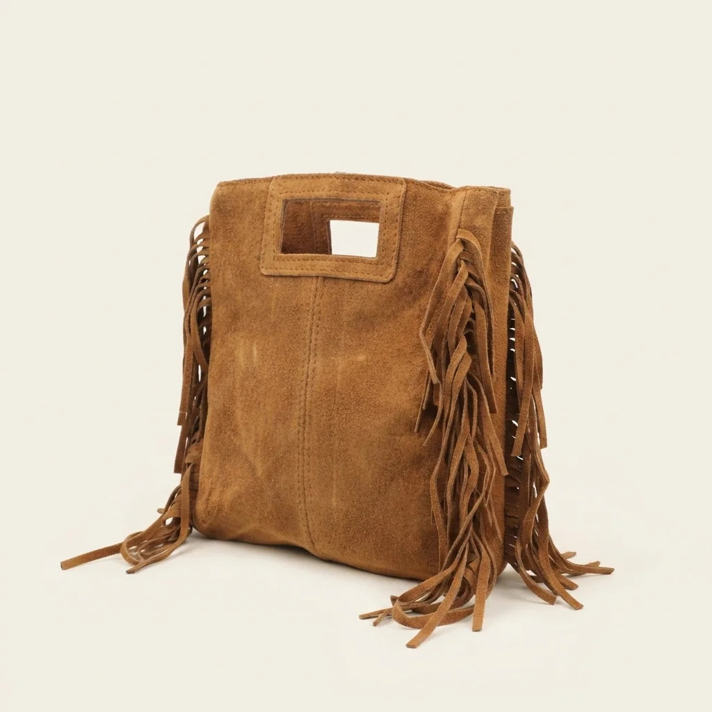 Camel tan fringe shoulder bag, three-quarter angle showing side depth