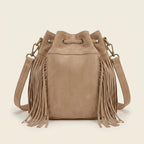 Back panel of Khaki tan suede fringe bucket bag with strap attachments