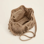 Interior lining and pockets of Khaki tan suede fringe bucket bag