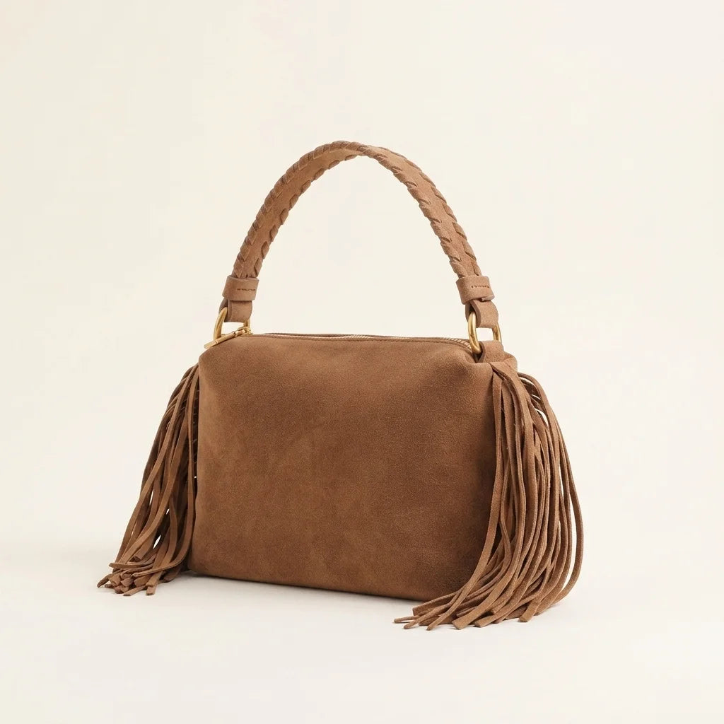 Brown tan suede fringe clutch bag, three-quarter angle showing side depth