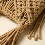 Close-up of fringe stitching and texture on Beige tassel fringe clutch bag