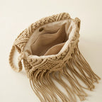 Interior lining and pockets of Beige tassel fringe clutch bag