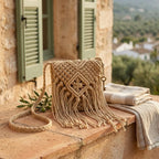 Beige tassel fringe clutch bag styled in a warm Mediterranean setting