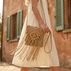 Woman wearing Beige tassel fringe clutch bag with swaying fringe