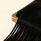 Close-up of fringe stitching and texture on Black tassel fringe clutch bag