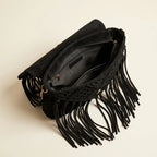 Interior lining and pockets of Black tassel fringe clutch bag