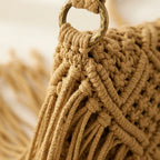 Close-up of fringe stitching and texture on Khaki tassel fringe clutch bag