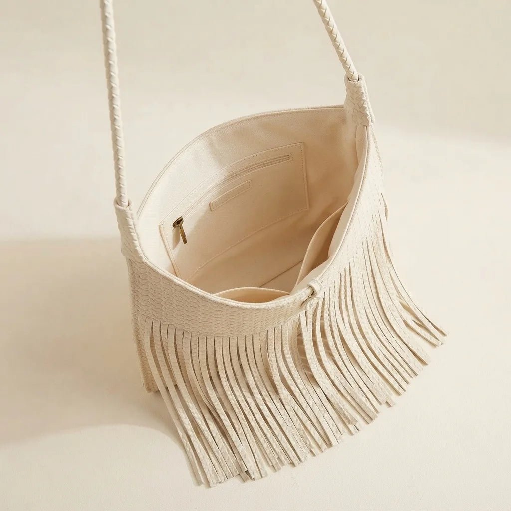 Interior lining and pockets of Beige tassel fringe hobo bag