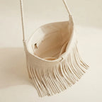 Interior lining and pockets of Beige tassel fringe hobo bag