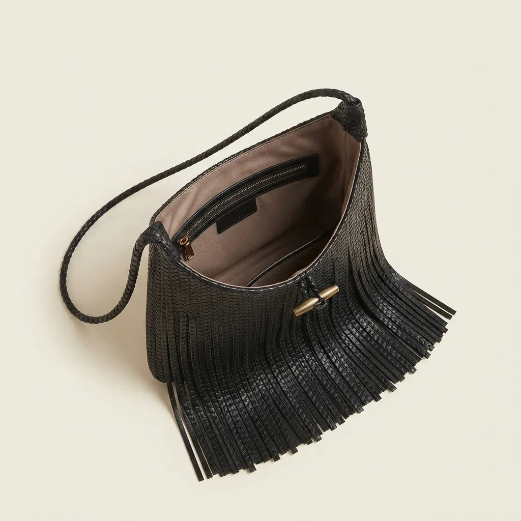 Interior lining and pockets of Black tassel fringe hobo bag