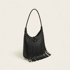 Black tassel fringe hobo bag, three-quarter angle showing side depth