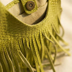 Close-up of fringe stitching and texture on Green tassel fringe hobo bag