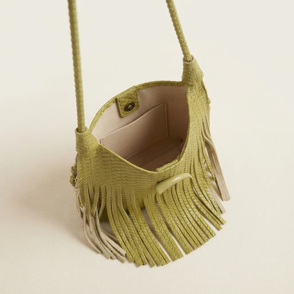 Interior lining and pockets of Green tassel fringe hobo bag