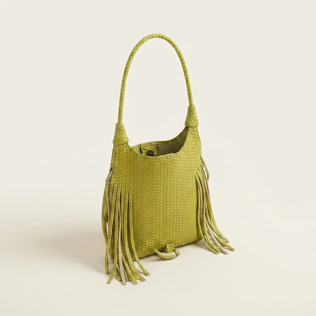 Green tassel fringe hobo bag, three-quarter angle showing side depth