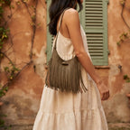 Woman wearing Khaki tassel fringe hobo bag with swaying fringe